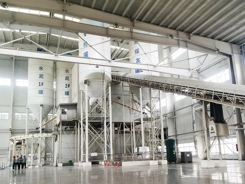 Indoor powder silos and aggregate conveyor for precast concrete