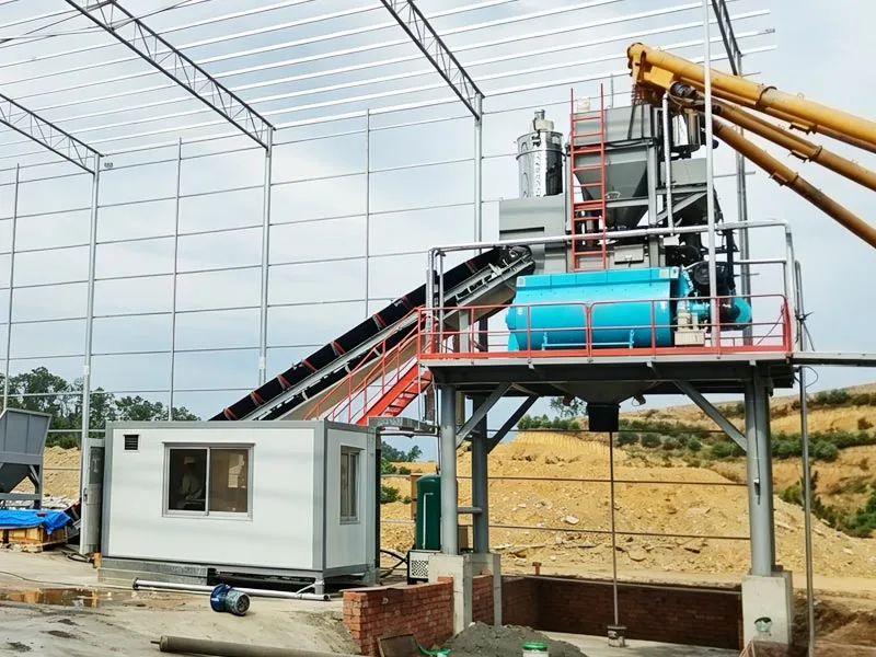Modular concrete mixer and control cabin during site installation